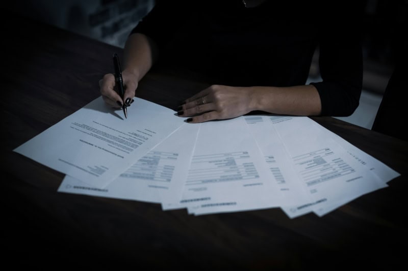 images shows a desk of paperwork that might be required for a portable cabin