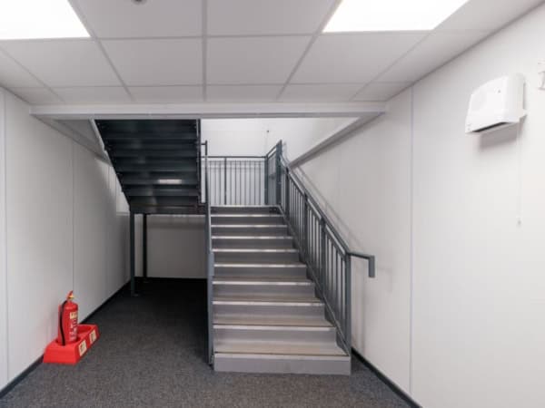 Image shows a stairwell in a modular school building.